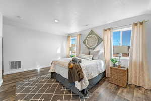 Bedroom featuring dark hardwood / wood-style flooring