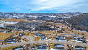 Snowy aerial view with a mountain view