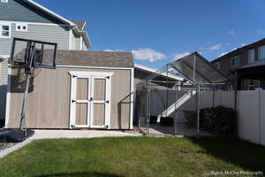 View of outbuilding featuring a yard