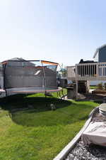 View of yard featuring a trampoline