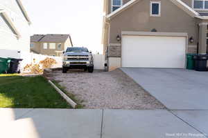 View of property exterior with a garage