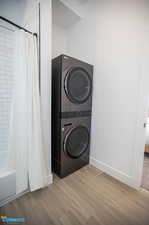 Washroom featuring stacked washer / dryer. This is in the full bathroom