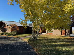 View of front of property featuring a front lawn