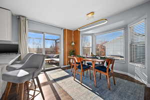 Dining room featuring plenty of natural light and dark hardwood / wood-style floors