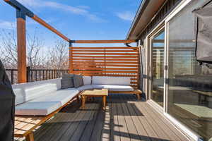 Wooden deck with an outdoor hangout area