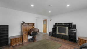 Office with dark hardwood / wood-style floors