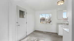 Unfurnished dining area featuring light hardwood / wood-style flooring