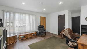 Office space with dark wood-type flooring