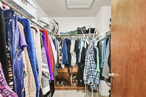 Walk in closet featuring light tile patterned flooring