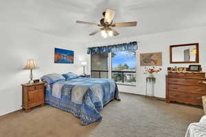 Bedroom featuring ceiling fan and light colored carpet