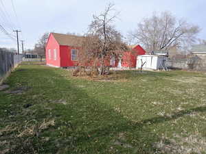 View of yard with a storage shed