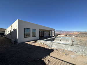 Rear view of house featuring a mountain view