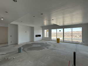 Unfurnished living room with plenty of natural light