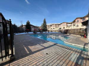 View of swimming pool with a patio