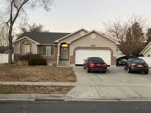 Ranch-style home featuring a garage