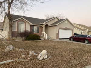 Single story home featuring a garage