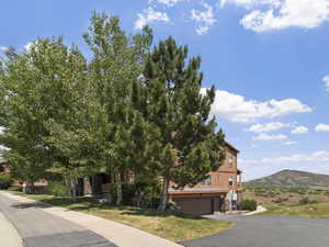 View of front facade featuring a mountain view and a garage