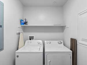 Laundry room with washer and clothes dryer