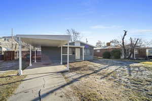 View of front of house featuring a carport