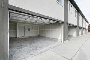 Garage with electric panel and a garage door opener