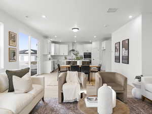 Living room featuring sink and light wood-type flooring