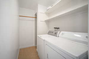 Washroom featuring separate washer and dryer