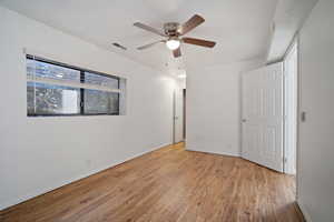 Unfurnished room featuring ceiling fan, a textured ceiling, and light hardwood / wood-style flooring