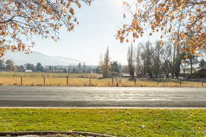 View of yard with a mountain view and a rural view