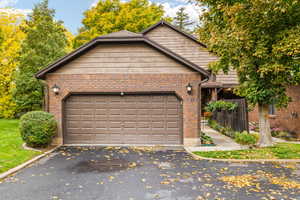 View of front facade featuring a garage