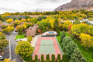 Bird's eye view of tennis court, pool, and clubhouse