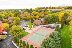 Bird's eye view of tennis court, pool, and clubhouse