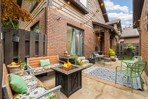 View of front patio / terrace with a fire pit