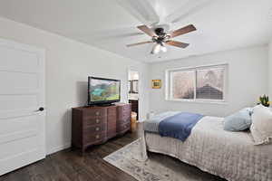 Primary Bedroom featuring ensuite bathroom, ceiling fan, and dark wood-type flooring