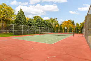 View of sport court featuring basketball hoop