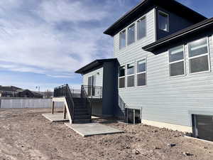 Back of property featuring a deck