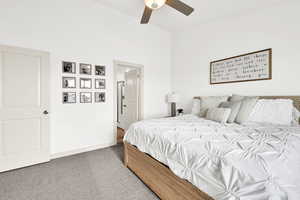 Carpeted bedroom with ceiling fan