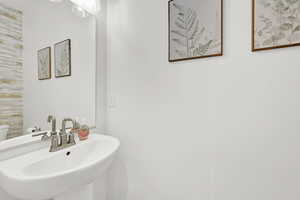 Bathroom featuring sink and toilet