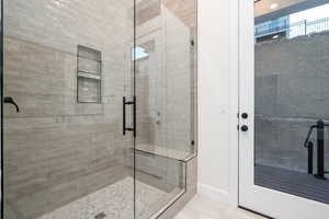 Bathroom with tile patterned floors and walk in shower