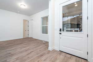 Interior space with light hardwood / wood-style floors