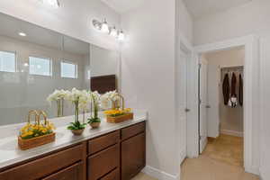 Bathroom featuring vanity and tile patterned flooring