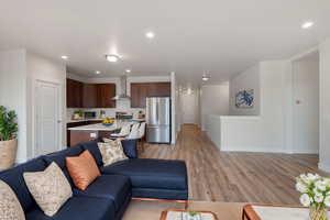 Living room with light hardwood / wood-style flooring