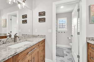 Bathroom with vanity and toilet