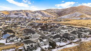 Snowy aerial view featuring a mountain view