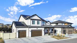 View of front of property with solar panels