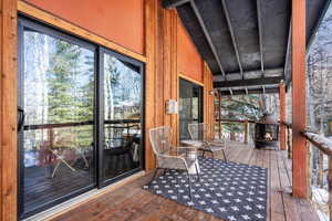 Unfurnished sunroom with vaulted ceiling with beams