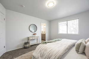 Bedroom featuring carpet floors and ensuite bath