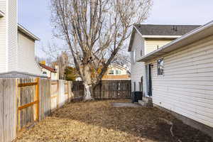 View of yard with central AC unit