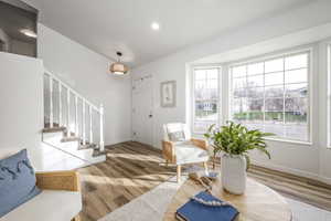 Entrance foyer featuring hardwood / wood-style floors