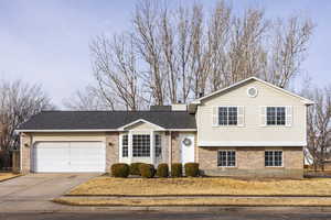 Split level home featuring a garage