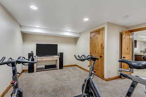 Exercise room with carpet flooring